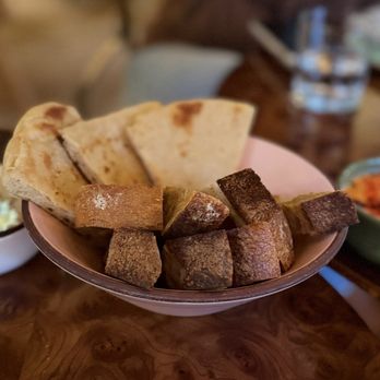 Leu Leu - Feta and Red Pepper and Roasted Garlic Hummus with pita bread and Prager Brothers bread. - Lounges Near Me - Encinitas, California