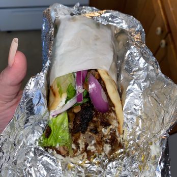 Pontos Taverna - a hand holding a burrito - Greek Near Me - Norwalk, Connecticut Pontos Taverna - a hand holding a burrito - Greek Near Me - Norwalk, Connecticut