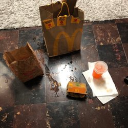McDonald's - The bag was soaked half of my drink was gone the food was really cold and I didn't receive an item