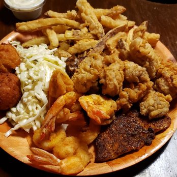 Crab Trap - Blackened flounder, fried shrimp and fried oysters.  All good.  Fries were different.   Not bad just not my liking. - Seafood Near Me - St. Simons, Georgia