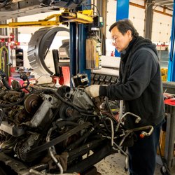 Kneble's Auto Service Center - One of our technicians preparing a replacement engine