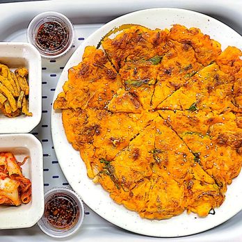 K Bobsang - a tray of food including a pizza and fries - Korean Near Me - Centreville, Virginia K Bobsang - a tray of food including a pizza and fries - Korean Near Me - Centreville, Virginia