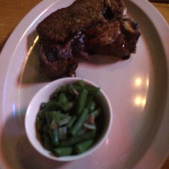 Doe's Eat Place - T-Bone with side of southern-style green beans - Steakhouses Near Me - Fort Smith, Arkansas