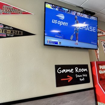 Mountain Mike's Pizza - a large tv mounted on the wall - Pizza Near Me - San Rafael, California Mountain Mike's Pizza - a large tv mounted on the wall - Pizza Near Me - San Rafael, California