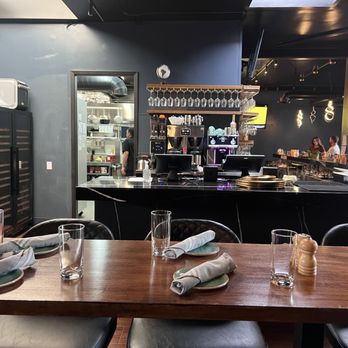 Sage Leaf - 4/9/26 FYI. Counter table & bar seating in the background - New American Near Me - Reno, Nevada