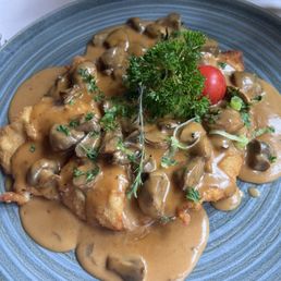 Schnitzel with cream and mushroom sauce.