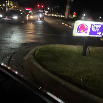 Taco Bell - a taco bell drive thru sign at night - Fast Food Near Me - Buford, Georgia