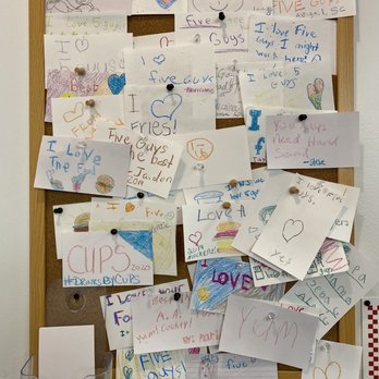 Five Guys - a bulletin board covered with love notes - Burgers Near Me - Hanover, Maryland Five Guys - a bulletin board covered with love notes - Burgers Near Me - Hanover, Maryland