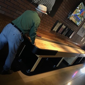 Linksters Taproom - a man standing at a bar - Beer Bar Near Me - Sarasota, Florida Linksters Taproom - a man standing at a bar - Beer Bar Near Me - Sarasota, Florida