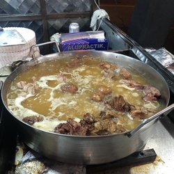 Tacos Los De La Indiana - Meat and potatoes cooking in the cazo