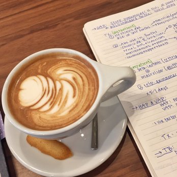 Arriviste Coffee Roasters - Latte comes with a cute butter cookie - Coffee & Tea Near Me - Pittsburgh, Pennsylvania