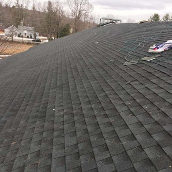 Jasmor Properties - the roof of a home with a damaged shingled roof - General Contractors Near Me - Loudon, New Hampshire Jasmor Properties - the roof of a home with a damaged shingled roof - General Contractors Near Me - Loudon, New Hampshire