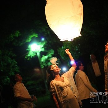 Stable Studio - a woman holding a lantern in the air - Recording & Rehearsal Studios Near Me - Spencer, Indiana