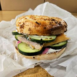 Lefty's Bagels - Trout Sammy on onion bagel with cucumber and pickled onion