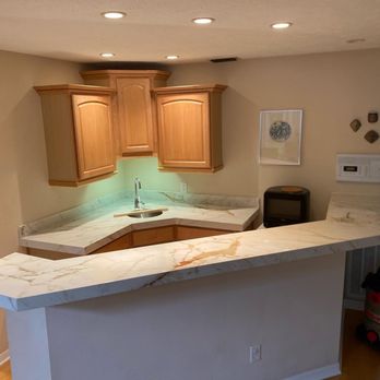 AGS Stone - a kitchen with a marble counter top - Countertop Installation Near Me - Tampa, Florida