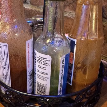 El Toro - Almost empty hot sauce bottles. - Mexican Near Me - Dayton, Ohio