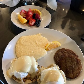 Caribsea - Crab cakes egg Benedict, grits, sausage, fruit, muffins - Seafood Near Me - Emerald Isle, North Carolina Caribsea - Crab cakes egg Benedict, grits, sausage, fruit, muffins - Seafood Near Me - Emerald Isle, North Carolina