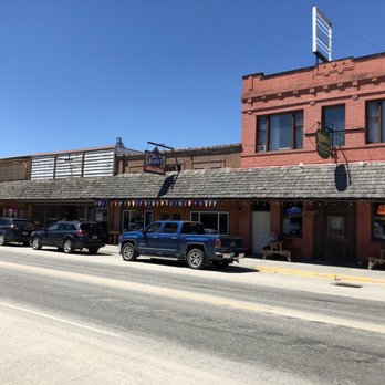 Little Blue Joint - cars parked in front of a red brick building - American Near Me - Darby, Montana