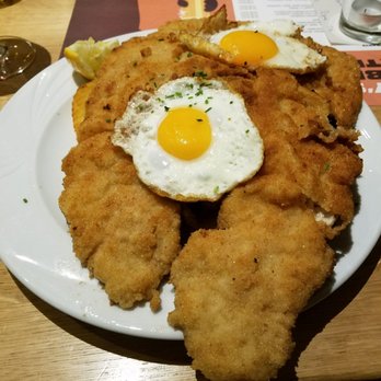 Andy's Krablergarten - Schnitzel with two fried eggs. Enough for two to share one plate! - German Near Me - Munich, BY Andy's Krablergarten - Schnitzel with two fried eggs. Enough for two to share one plate! - German Near Me - Munich, BY