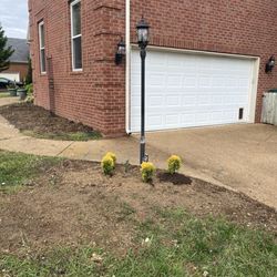 Hathaway's Demo Construction Environmental Services - Removed bushes from lamp post and side of the house.