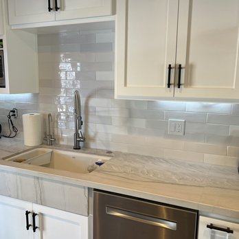 Tile by Vincent - a kitchen with white cabinets and stainless steel appliances - General Contractors Near Me - Winnetka, California Tile by Vincent - a kitchen with white cabinets and stainless steel appliances - General Contractors Near Me - Winnetka, California