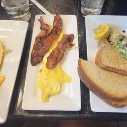 Banana waffle, eggs, bacon, cheesesteak omelet & grits (I forgot to get a picture of the bacon and sausage omelet)