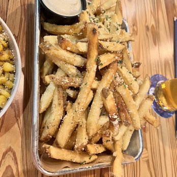 Octopi Brewing - a tray of fries and a bowl of dip - Breweries Near Me - Waunakee, Wisconsin Octopi Brewing - a tray of fries and a bowl of dip - Breweries Near Me - Waunakee, Wisconsin