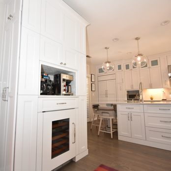 Planet Cabinets - Beverage center before "garage door" went on. Below is a wine fridge and oversized drawer for coffee mugs, storage above and on sides. - General Contractors Near Me - Chicago, Illinois