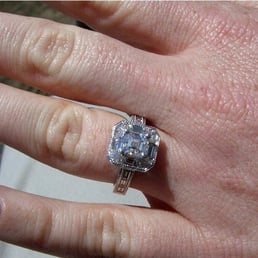 1+ carat asscher cut center stone set in a white gold/palladium mix with baguettes