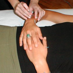Pamela Grant Acupuncture and Nutrition - A woman receives a gentle acupuncture treatment