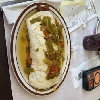 Frontier - Bacon breakfast burrito topped with extra green chilie (I asked for it smothered but I don't know that wasn't a thing) - Mexican Near Me - Albuquerque, New Mexico
