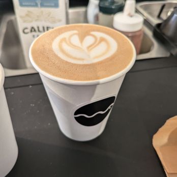 Masterpiece Coffee - Kuro (Okinawa black sugar oat milk latte, topped with sea salt) - Coffee & Tea Near Me - Berkeley, California Masterpiece Coffee - Kuro (Okinawa black sugar oat milk latte, topped with sea salt) - Coffee & Tea Near Me - Berkeley, California