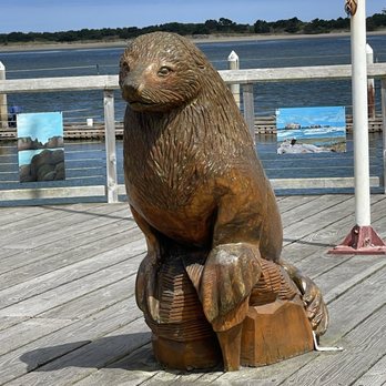 Old Town - Cute wood carved sea lion in in Bandon Old Town boardwalk. - Shopping Near Me - Bandon, Oregon