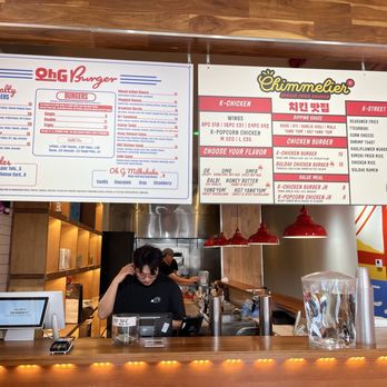 Oh G Burger - Menu - Two menu boards above the counter at Oh G Burger in Berkeley, CA, list burger options, sides, and Korean fried chicken dishes. - Burgers Near Me - Berkeley, California