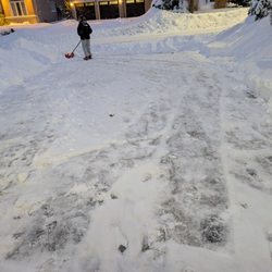 Lucas' Lawn & Landscape - This is my wife and I outside shoveling because we hired Lucas lawn and landscaping contractors to do our snow and they never showed up.