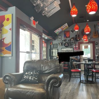 Bravado coffee cafe - a leather chair and a piano - Coffee & Tea Near Me - Villas, New Jersey