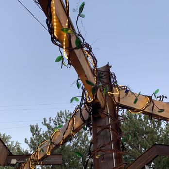 Skyline Kitchen & Vine - "Vines" on patio made from bent rebar and leaves made from recycled Jameson bottles - New American Near Me - Reno, Nevada Skyline Kitchen & Vine - "Vines" on patio made from bent rebar and leaves made from recycled Jameson bottles - New American Near Me - Reno, Nevada