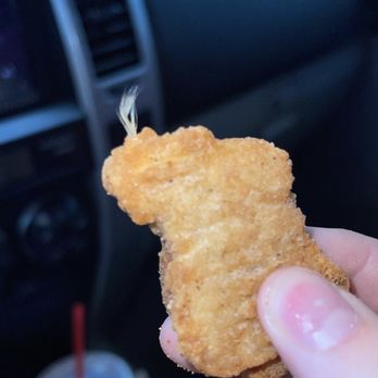 Wendy's - a person holding a piece of food in their hand - Burgers Near Me - Lufkin, Texas Wendy's - a person holding a piece of food in their hand - Burgers Near Me - Lufkin, Texas