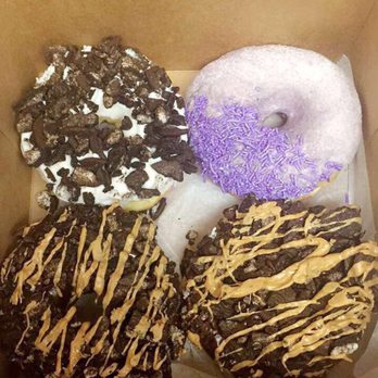 Voodoo Doughnut - Two Oreo peanut butter, Oreo and grape doughnut - Donuts Near Me - Denver, Colorado
