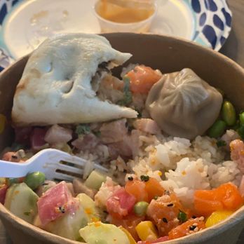 The Bowl - Two protein bowl with a soup dumpling and partially eaten pork bun. - Poke Near Me - Lynbrook, New York