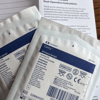 The Dental Specialists - Post-care:  complete written instructions, extra gauze, single-use ice pack (not pictured because I was using it - Oral Surgeons Near Me - Coon Rapids, Minnesota