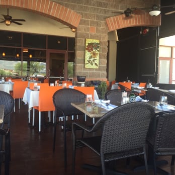 Harvest - Tables on the patio with cooling fans and beautiful view of the mountains. - New American Near Me - Oro Valley, Arizona