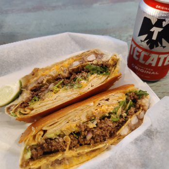 Burrito Works Taco Shop - UFO with the Workers. Tecate - Mexican Near Me - St. Augustine, Florida Burrito Works Taco Shop - UFO with the Workers. Tecate - Mexican Near Me - St. Augustine, Florida