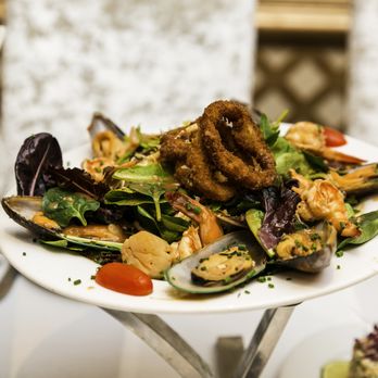 Golden Leo Restaurant - a plate of food on a table - Modern European Near Me - Brooklyn, New York