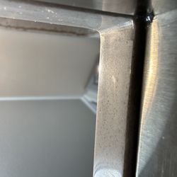 Toledo Custom Countertops - Counter flush with sink front and back. Sides overhang. One side overhangs more than the other