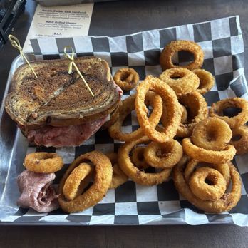 Happy Hour Sports Bar - Rueben sandwich with onion rings - Sports Bars Near Me - Waterloo, Illinois Happy Hour Sports Bar - Rueben sandwich with onion rings - Sports Bars Near Me - Waterloo, Illinois