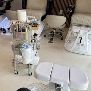 Myna Nail Salon - Pedicure chair and nail color books while waiting for service - Nail Salons Near Me - Clovis, California