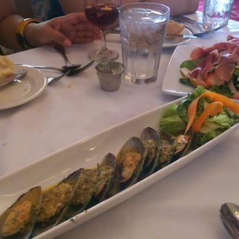 Lola's - Mussels with vinaigrette and seasonal salad with prosciutto - Spanish Near Me - New Orleans, Louisiana Lola's - Mussels with vinaigrette and seasonal salad with prosciutto - Spanish Near Me - New Orleans, Louisiana