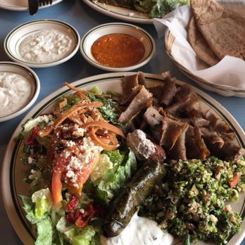 Roman's Cafe - Top is the flash grilled lamb plate and bottom is the Romans Salad add gyro. Do ask for their hot sauce (middle)! - Mediterranean Near Me - Baton Rouge, Louisiana Roman's Cafe - Top is the flash grilled lamb plate and bottom is the Romans Salad add gyro. Do ask for their hot sauce (middle)! - Mediterranean Near Me - Baton Rouge, Louisiana