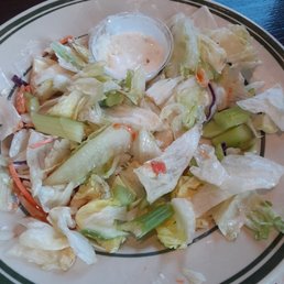 a plate of salad on a table a plate of salad on a table